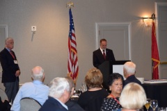 Neal Perdue introduces guest of honor as  Steve Benckenstein watches